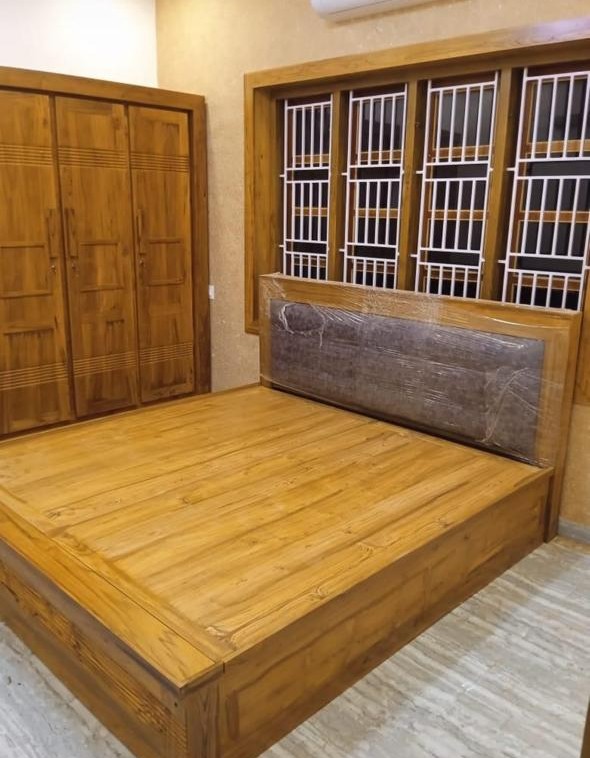 Wooden bedroom set with bed and wardrobe