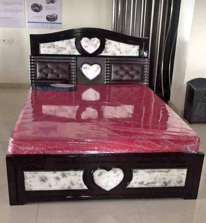Glossy black bed with heart motif inlays