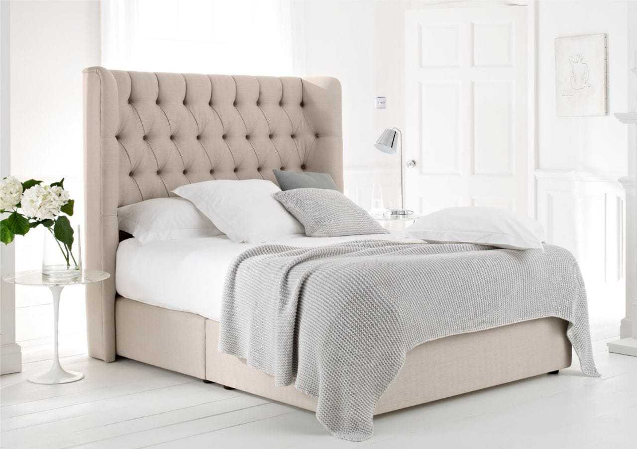 Cream tufted wingback upholstered bed