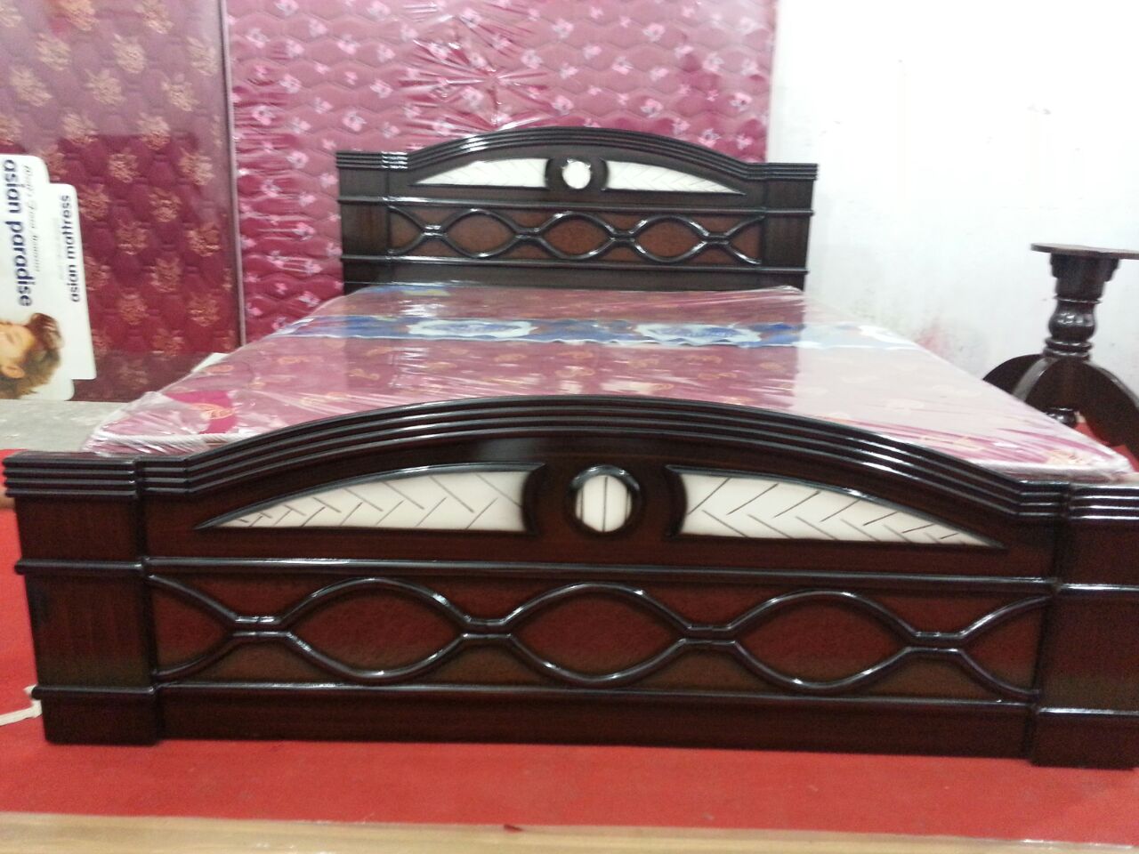 Wood bed with oval cutout headboard design