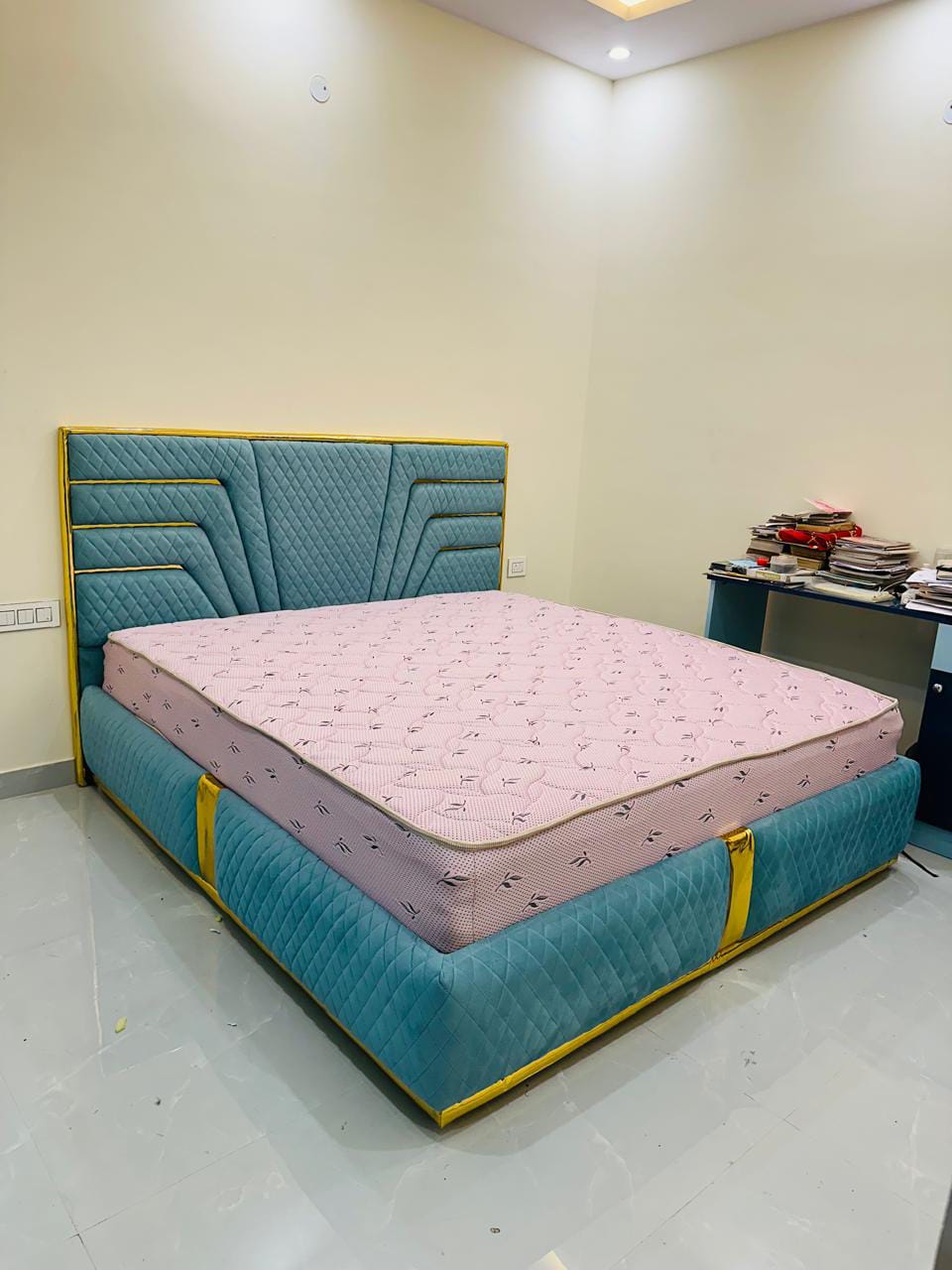 Teal velvet bed with gold trim