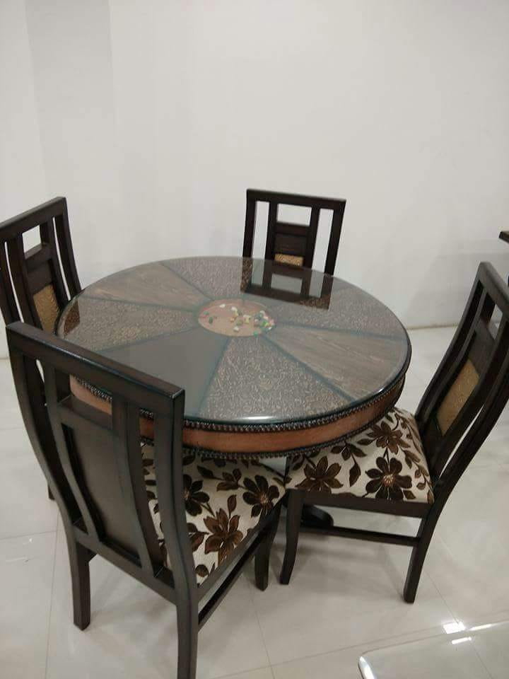 Round 4 seater dining set with floral cushions