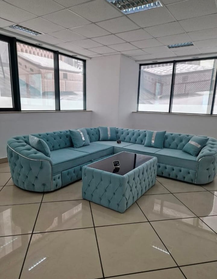 Teal chesterfield-style tufted corner sofa