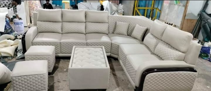 White quilted corner sofa with ottomans