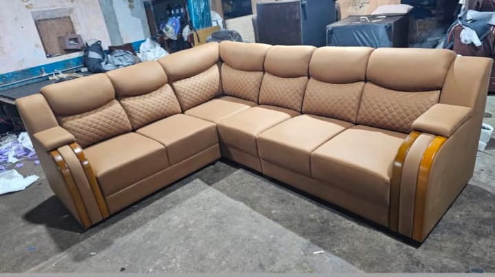 Tan corner sofa with wooden trim