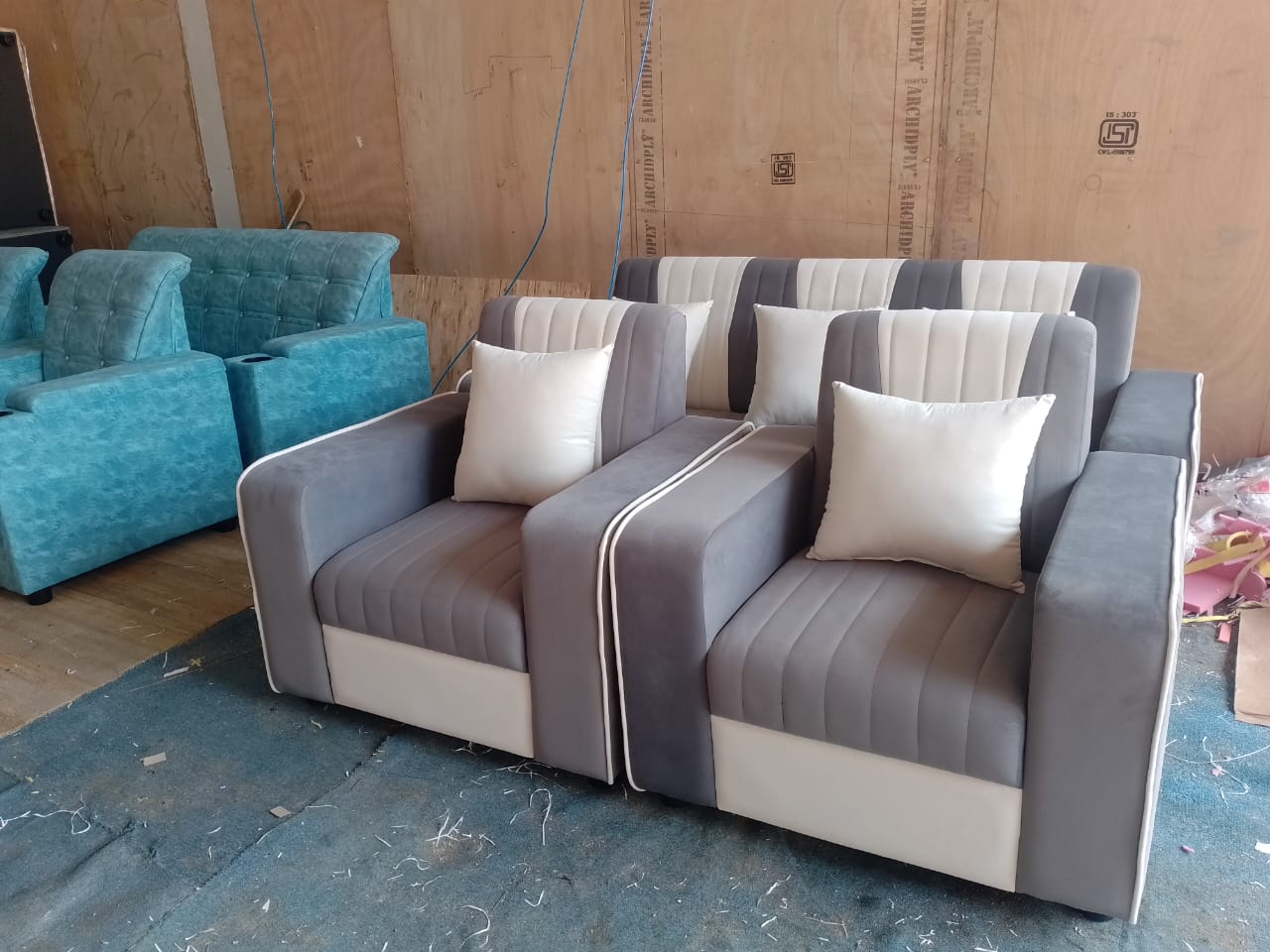 Grey channel-tufted recliner armchairs