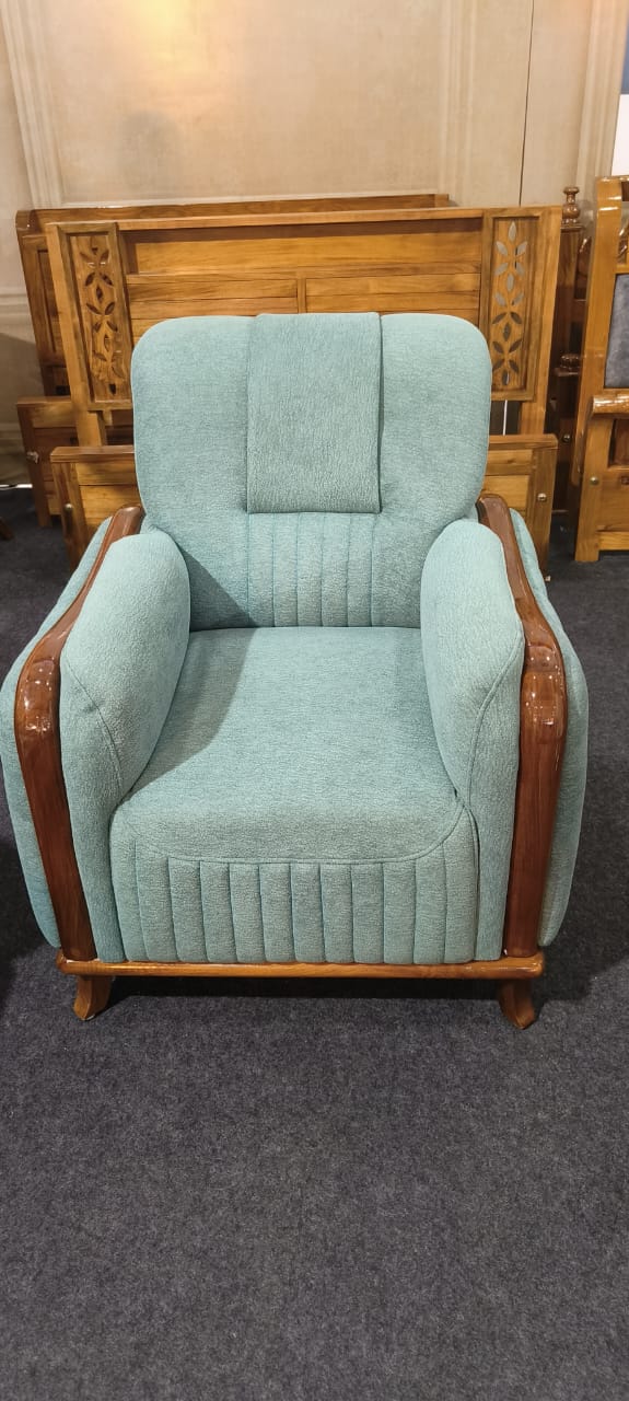 Sea-green recliner armchair with wooden trim
