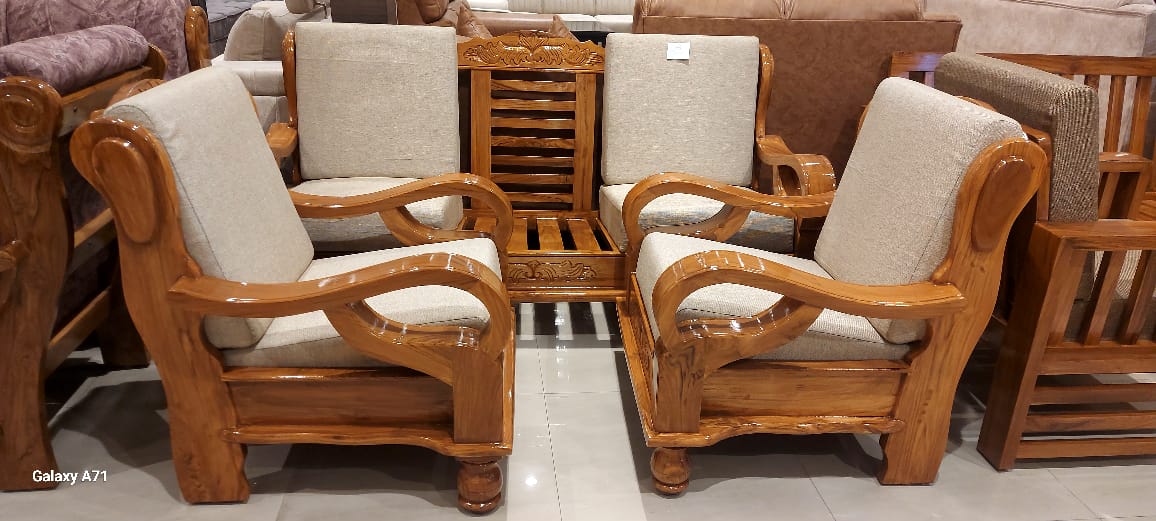 Glossy carved wood armchair pair with cream cushions