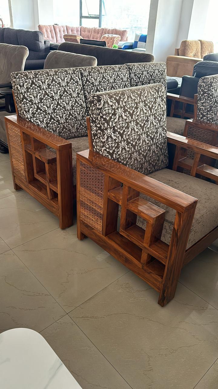 Wooden armchairs with cane side panels and damask cushions