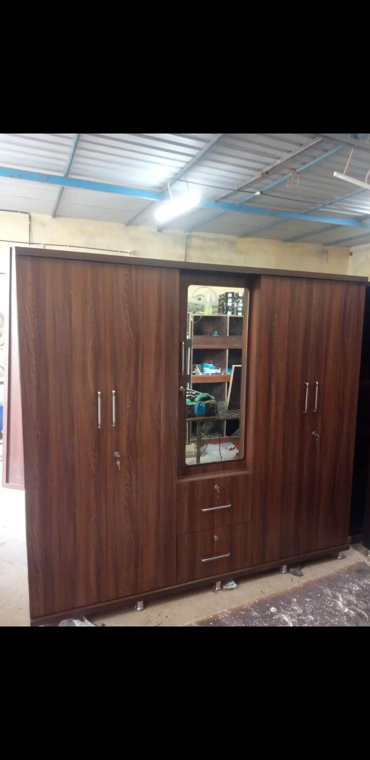 4-door wooden wardrobe with centre mirror and drawers